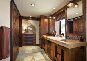 A bathroom with wooden cabinets and tile floors.