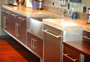 A kitchen with stainless steel cabinets and a sink.