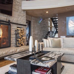 A living room with a fireplace and a couch